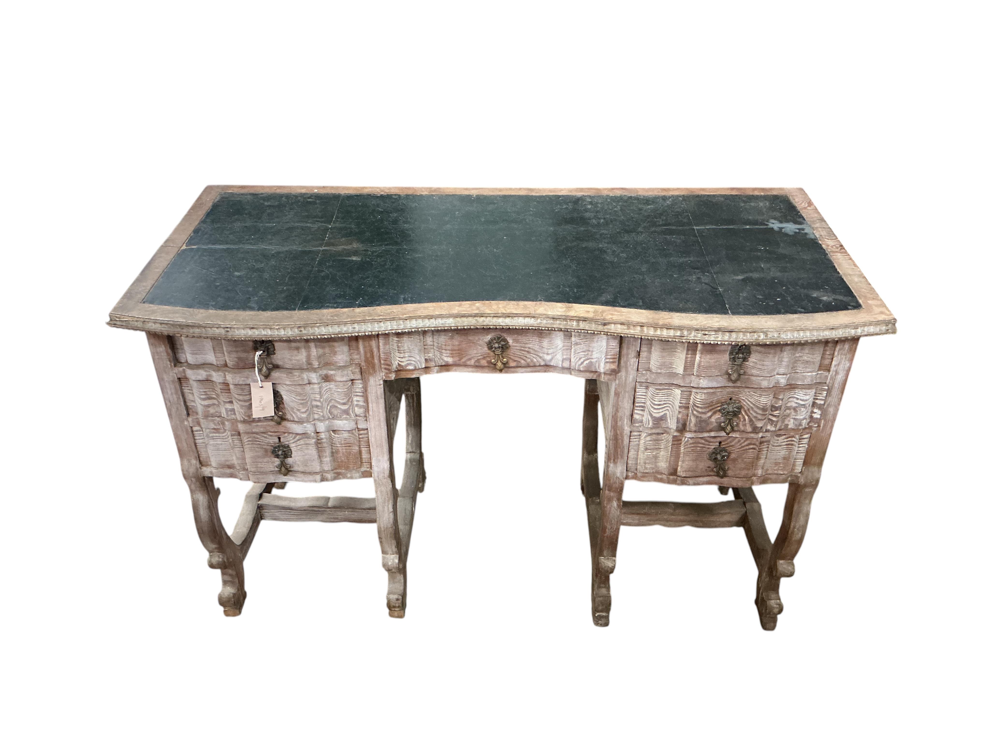 An early 20th century Continental bleached oak kneehole desk, width 122cm, depth 56cm, height 78cm